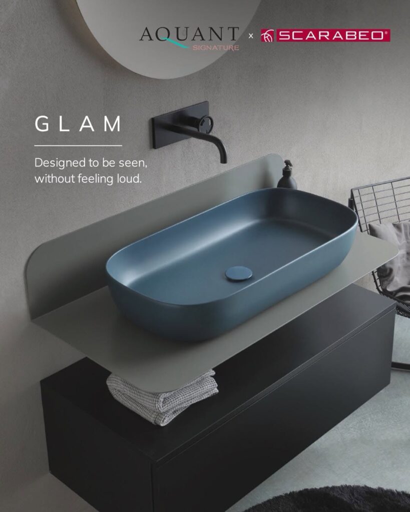 Luxury vessel wash basin in matte blue finish with wall-mounted black faucet
